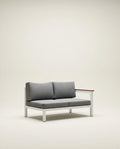 Gray sofa with wooden armrest on a beige background