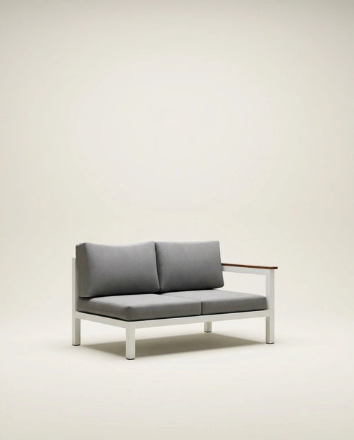Gray sofa with wooden armrest on a beige background
