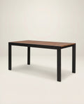 Wooden table with black metal legs on a white background